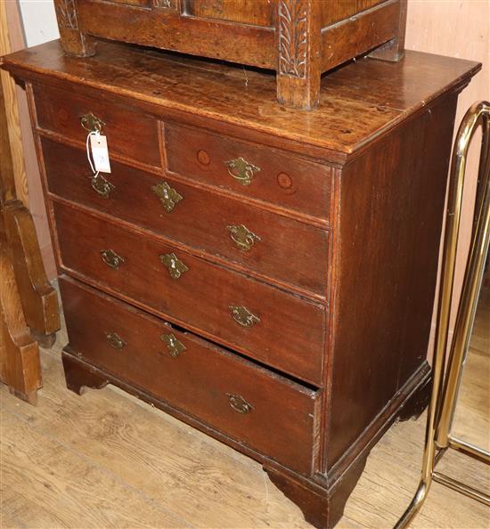 A George III oak chest, circa 1800, fitted two short drawers and three long drawers W.77cm